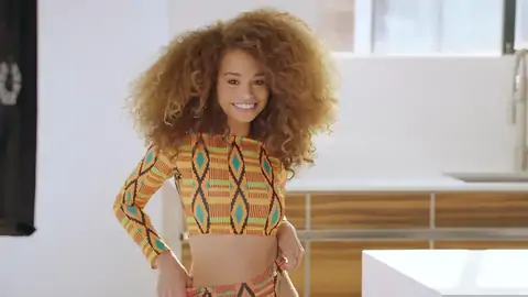 Teen dark-hued with wavy hair is railing a ample penis on the sofa